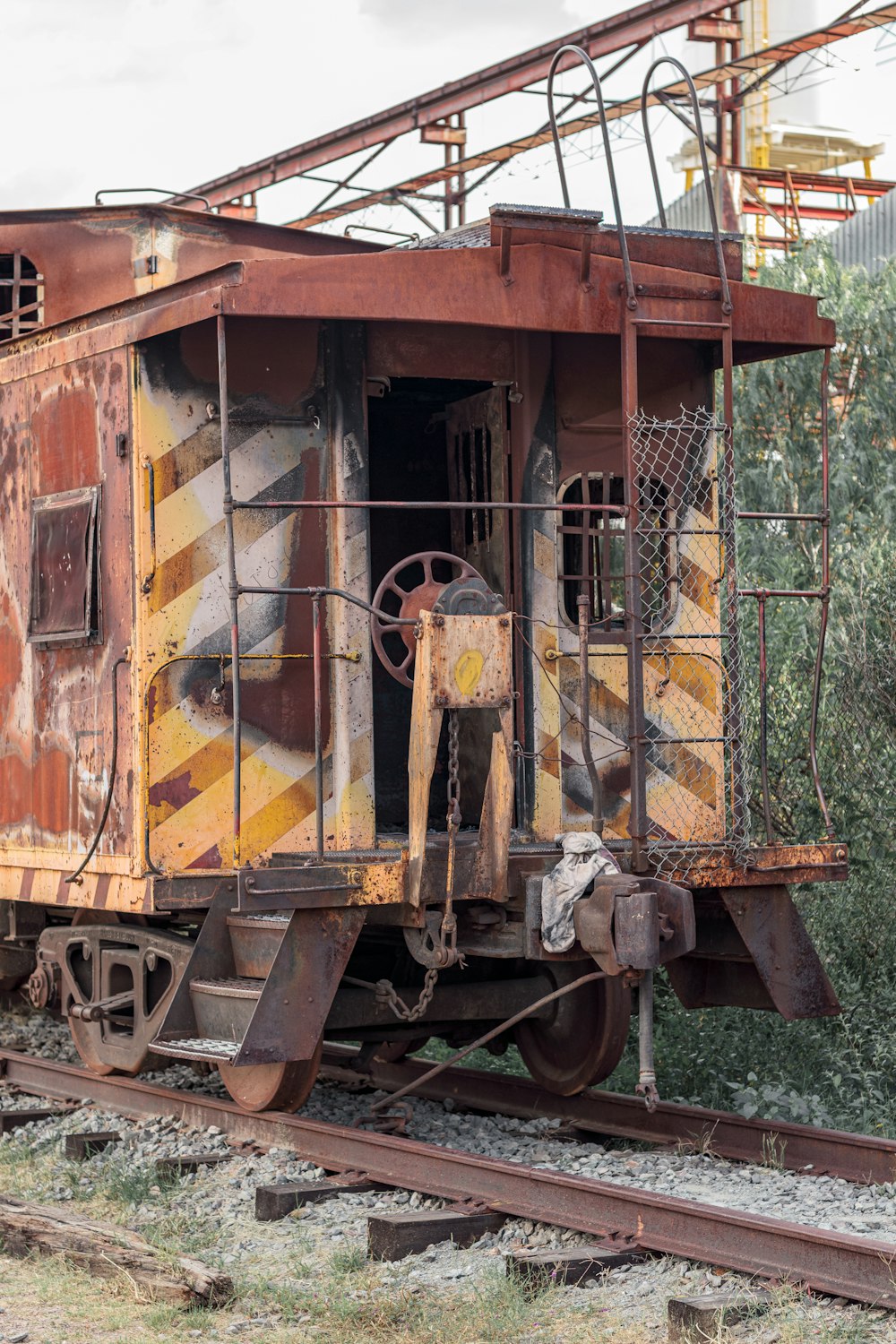 yellow and brown train on rail tracks