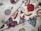 A collection of fabric swatches featuring various colorful designs. The patterns include a stylized hot air balloon, a rose, a rainbow, yin-yang symbol, pizza slice, a heart with flames, vintage cars, and other assorted graphics. The designs are vibrant and eclectic, with a mix of traditional and pop culture elements.