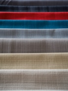 A collection of colorful fabric swatches arranged neatly.