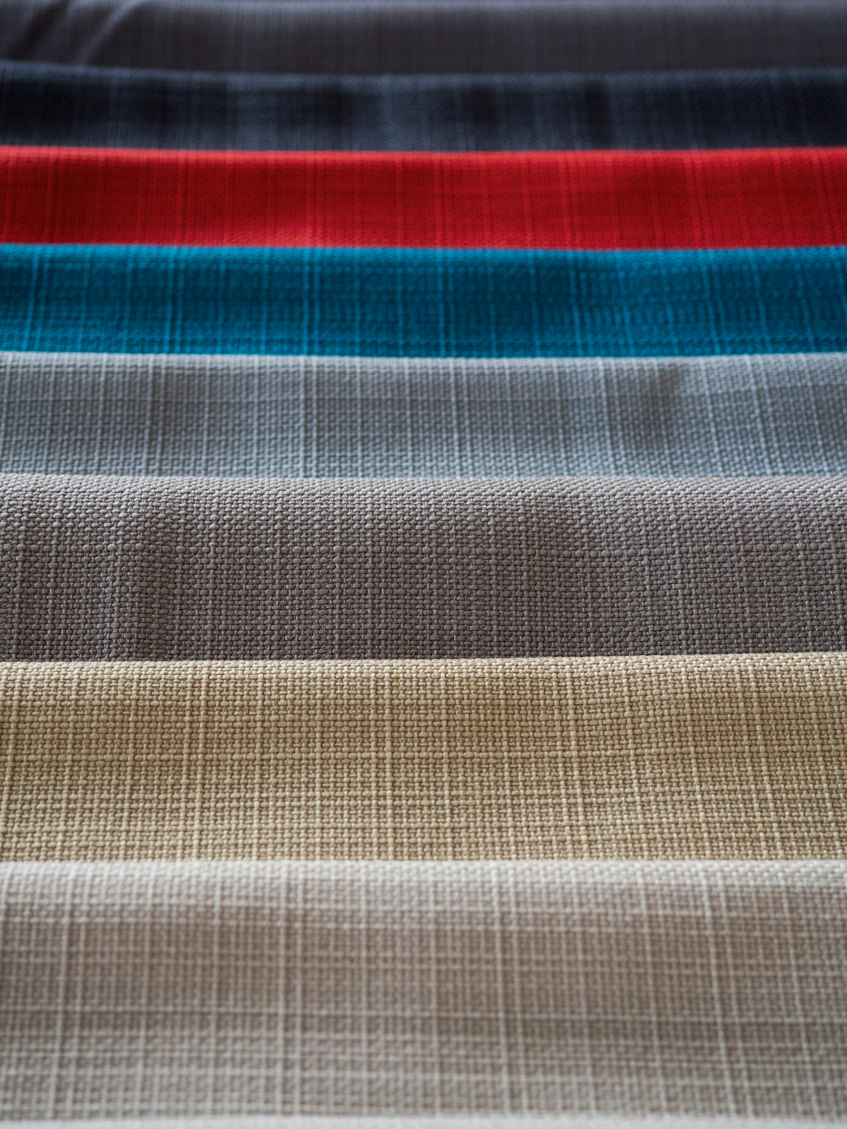 Striped textile swatch used for visual color matching and quality control comparison