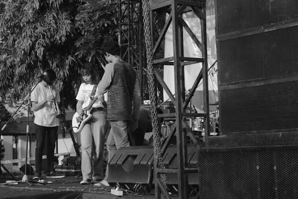 The band setting up their instruments backstage before a concert.