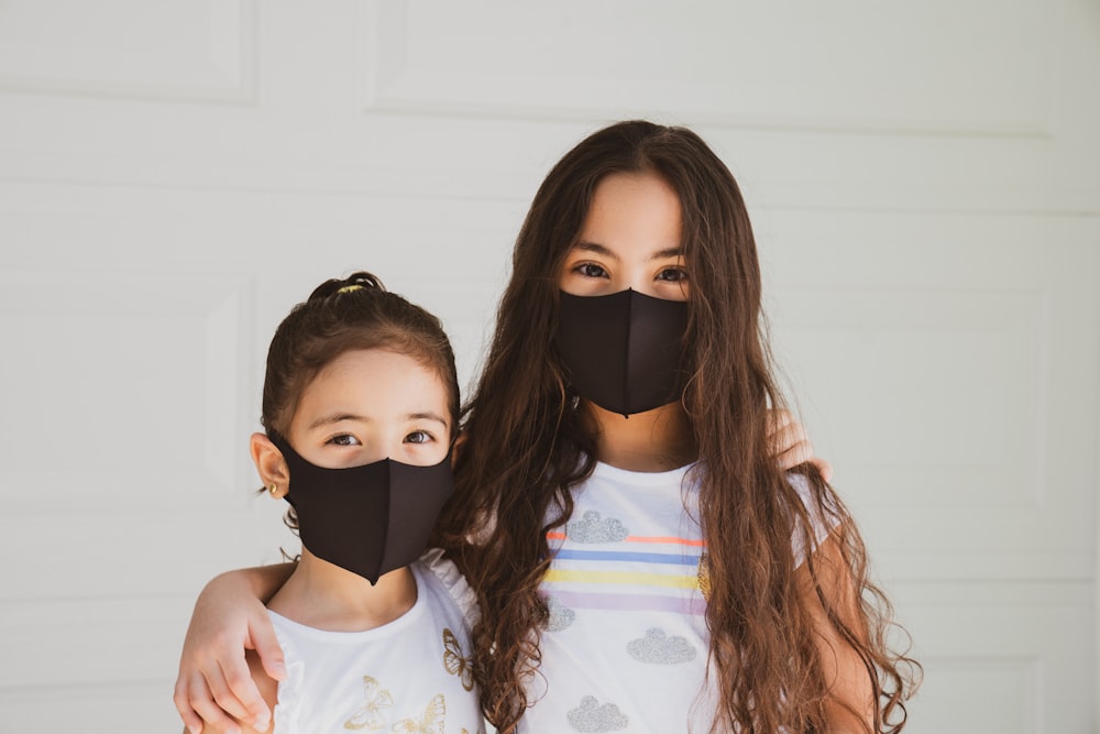 woman in white floral shirt wearing black goggles