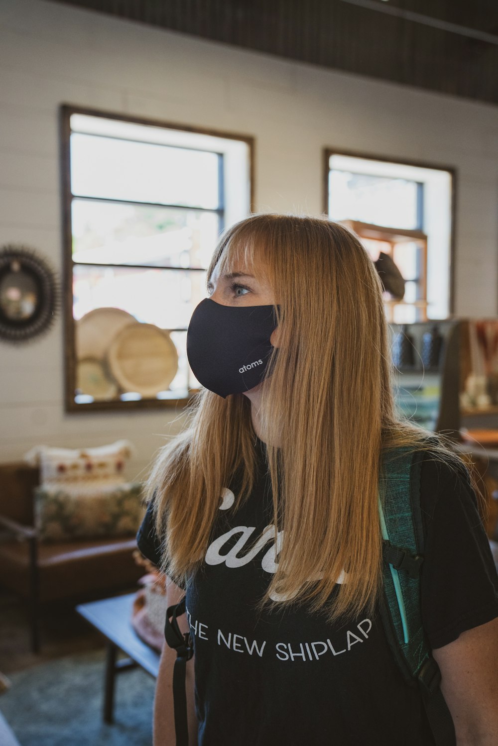 woman in black and white adidas shirt wearing black sunglasses