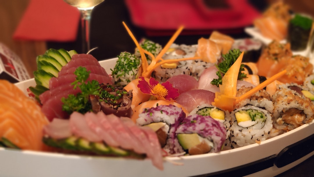 vegetable salad on white ceramic plate, Sushi boat with caret birds.
