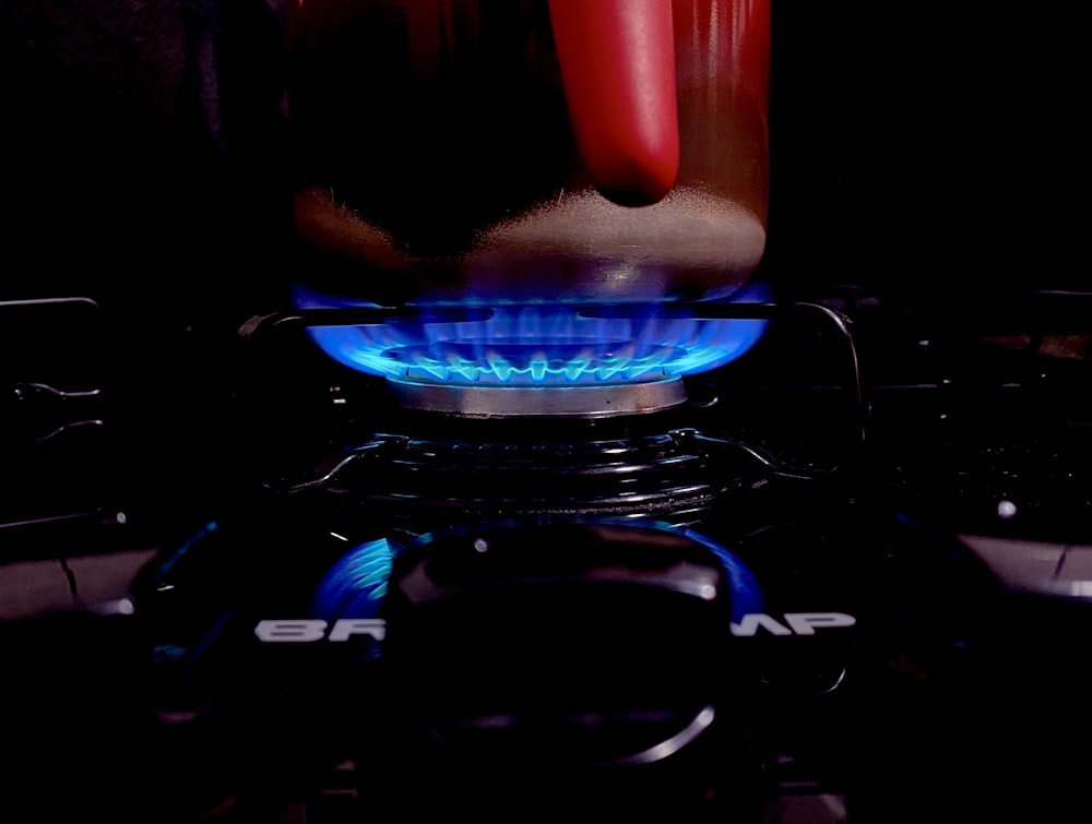 blue and red lighted gas stove