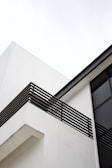 Modern residential building exterior with clean architectural lines.