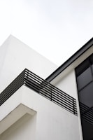 Modern residential building exterior with clean architectural lines.