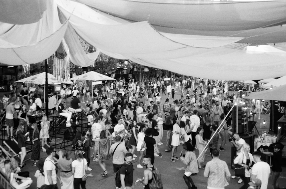 grayscale photo of people walking on street