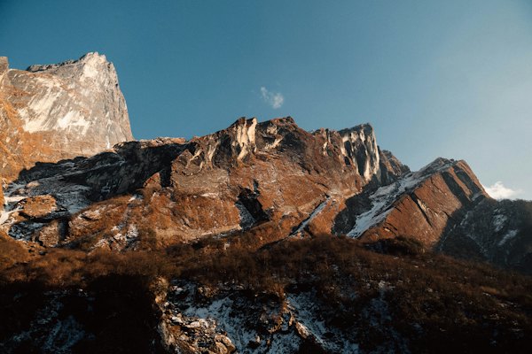 Brown rocky mountain under blue sky during daytime — Kathmandu & Pokhara, Nepal