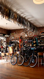 bicycle parked beside brown wooden table