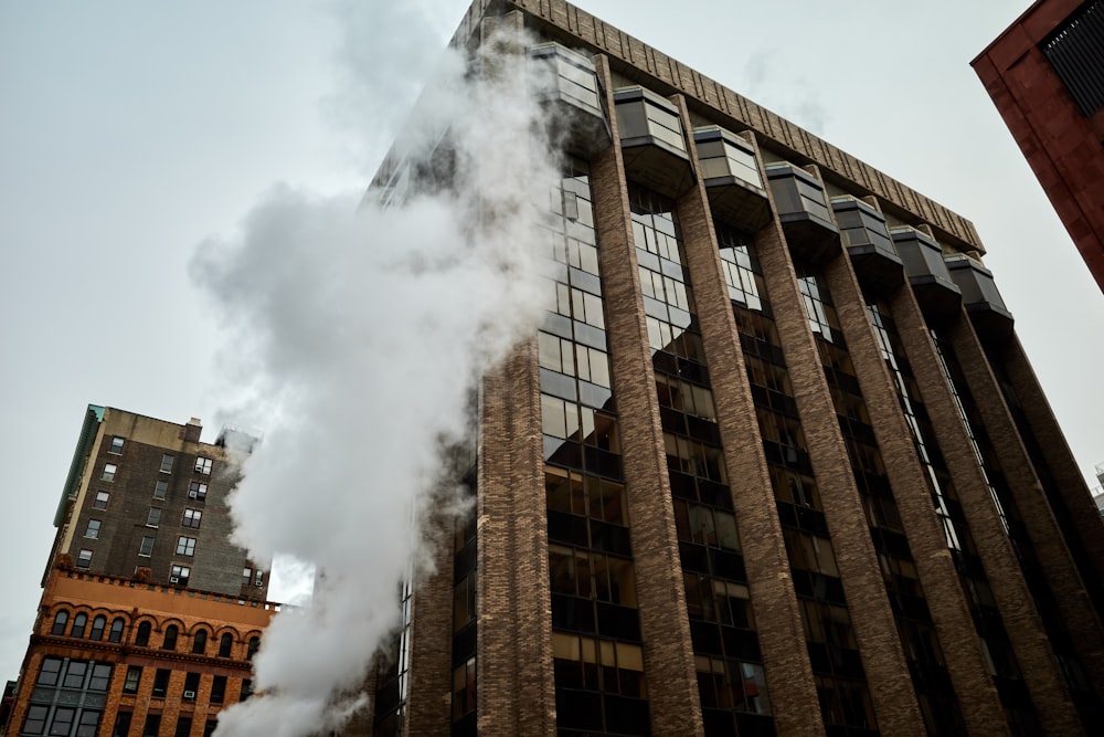 brown concrete building with smoke
