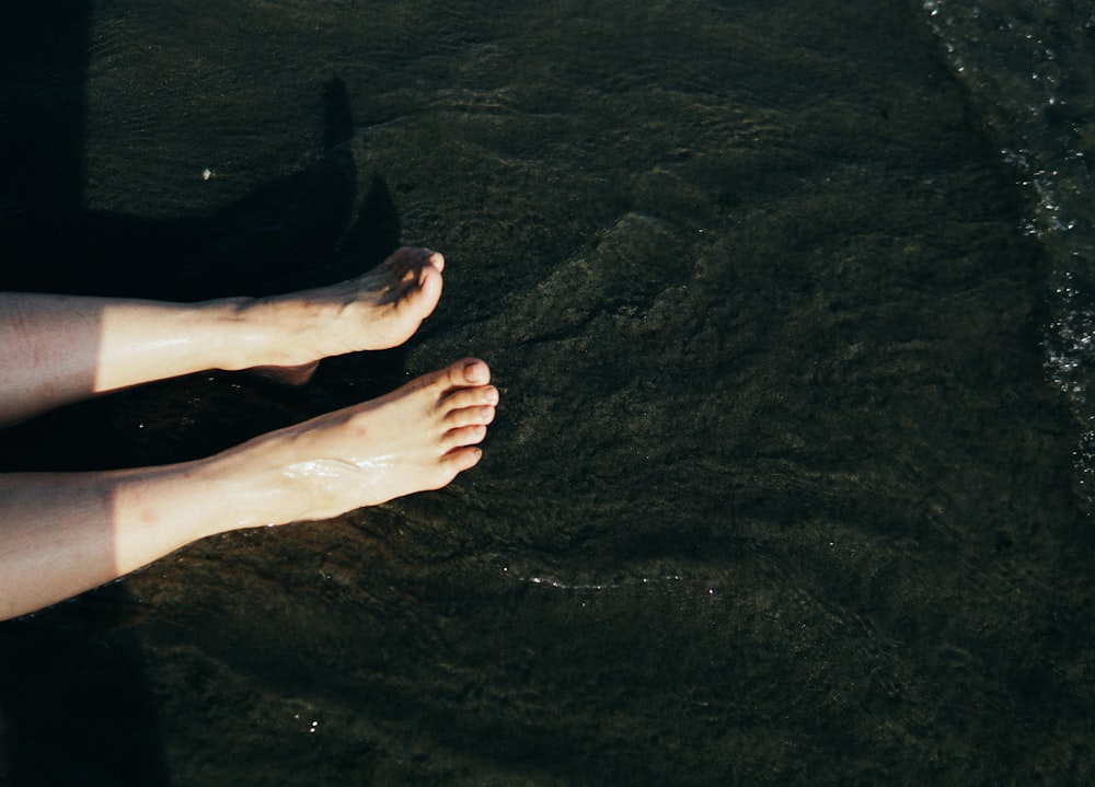 persons feet on water