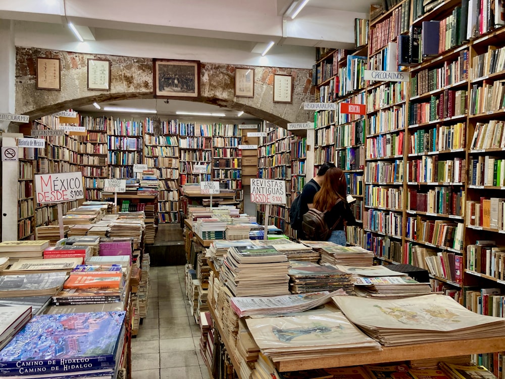 books on brown wooden shelf