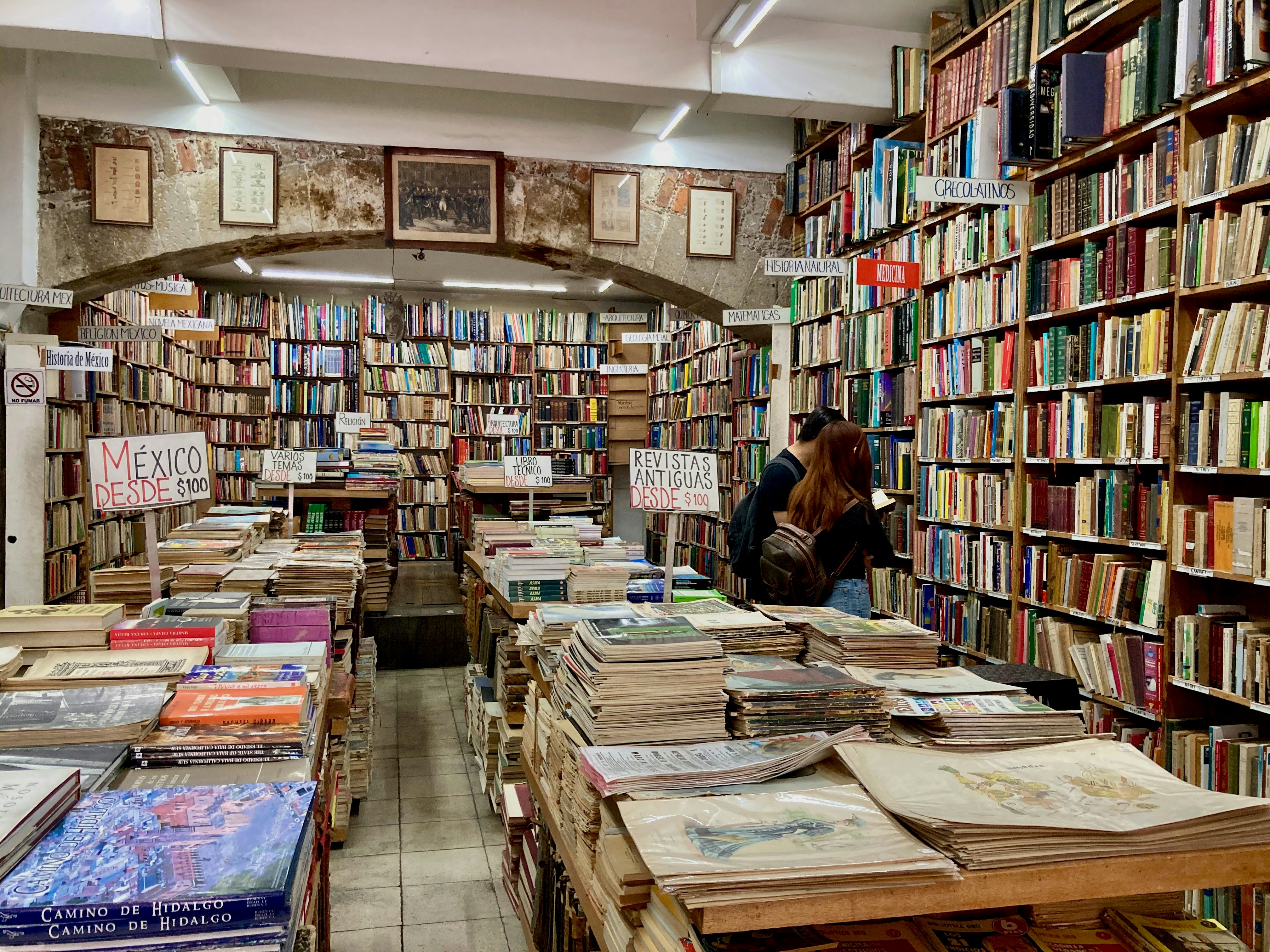 books on brown wooden shelf