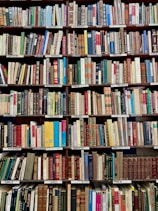 books on brown wooden shelf