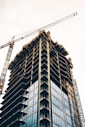black and white building with yellow crane