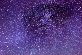 A vibrant night sky filled with stars and constellations, evoking the mysteries of astrology.