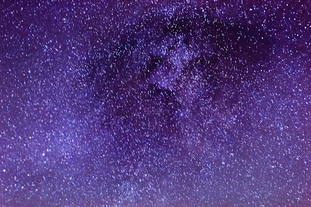 A vibrant night sky filled with stars and constellations, evoking the mysteries of astrology.