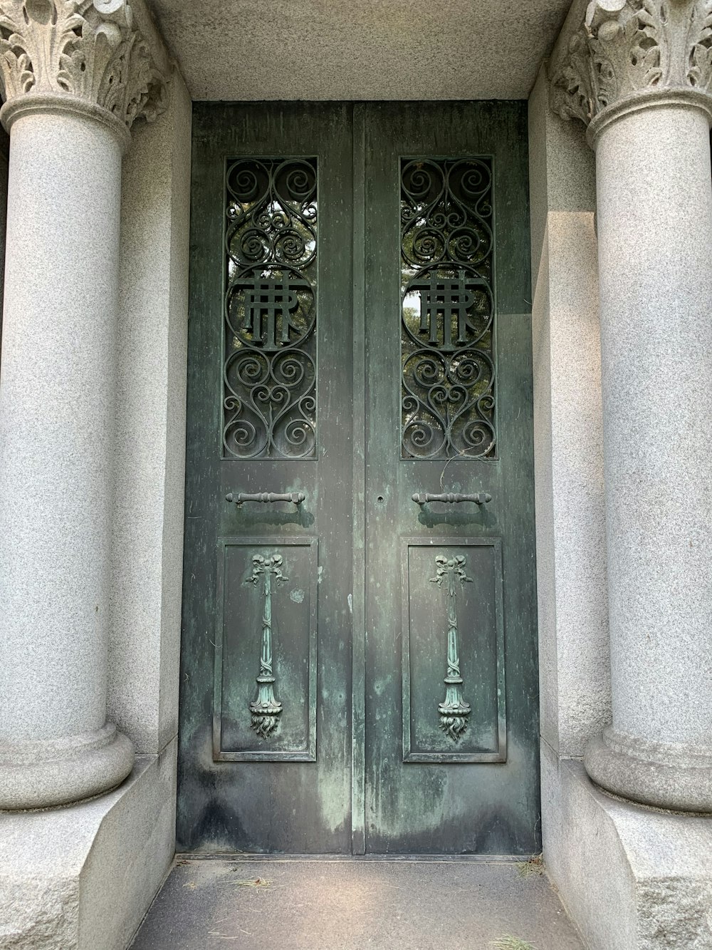 blue wooden door with white concrete wall