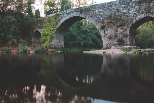 gray concrete bridge over river in Salvaterra de Miño Spain