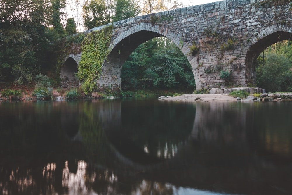 gray concrete bridge over river