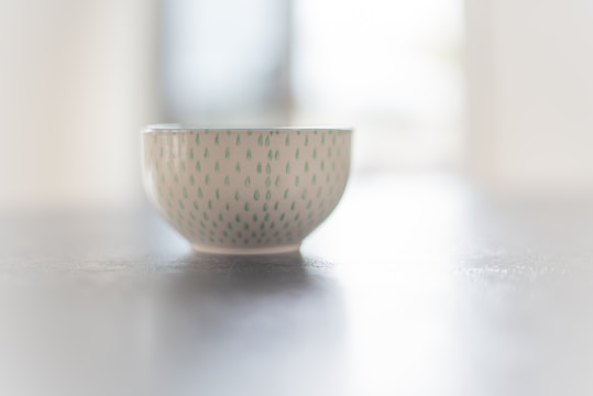 Close-up of a minimalist ceramic bowl with soft glaze, crafted by Kyoto artisans.