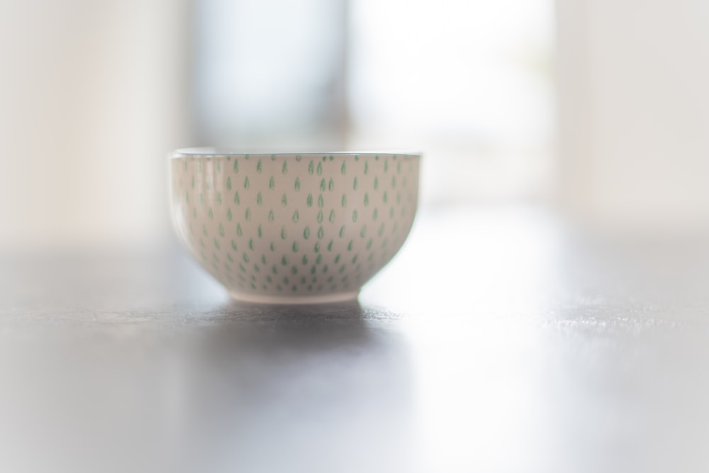 white ceramic bowl on white table