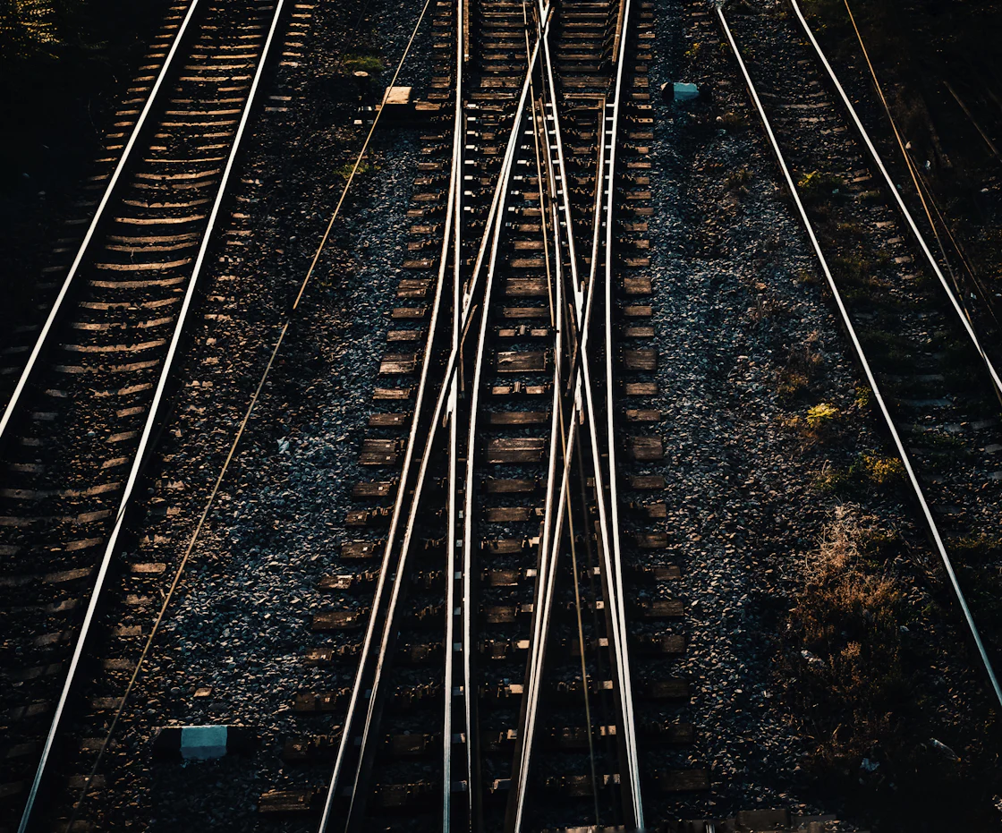 Railway tracks splitting and crossing in daylight
