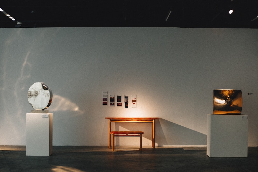 white wall with brown wooden table