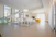 white chairs and table on white floor tiles