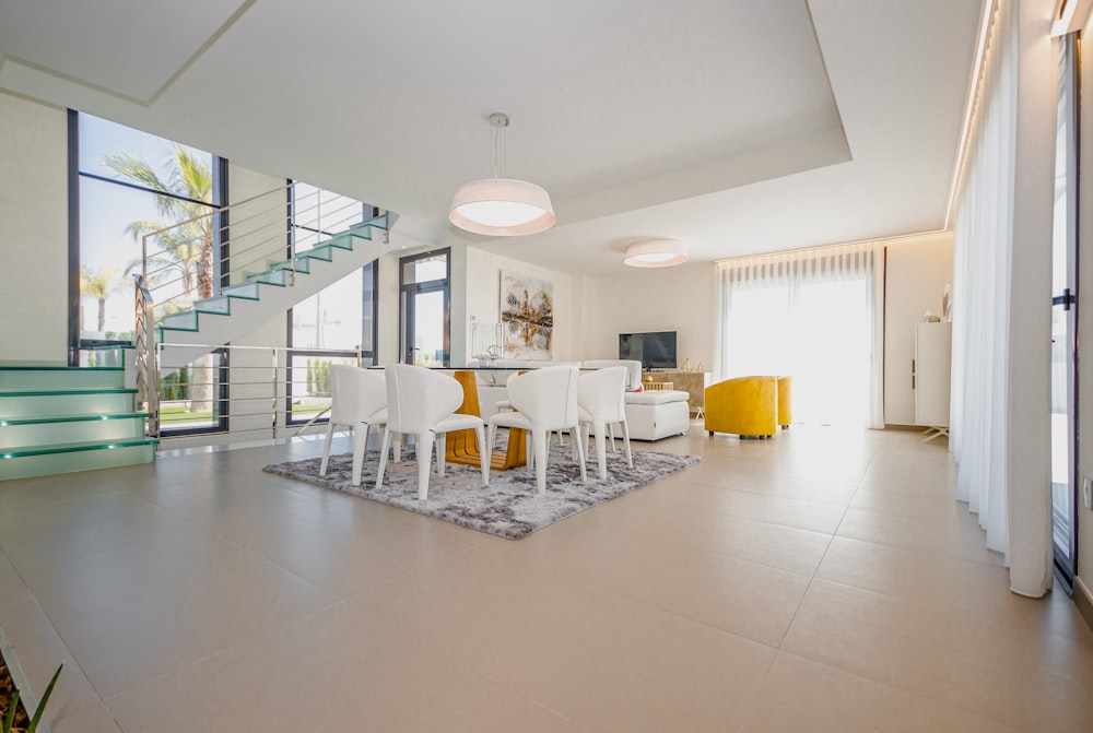 white chairs and table on white floor tiles