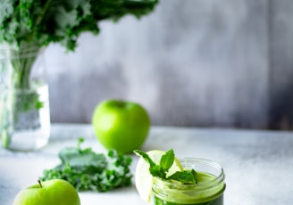 green apple fruit in clear glass cup