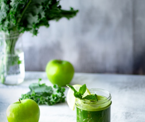 green apple fruit in clear glass cup