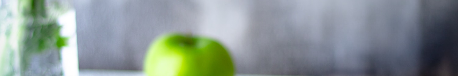 green apple fruit in clear glass cup