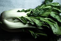 green vegetable on white ceramic plate