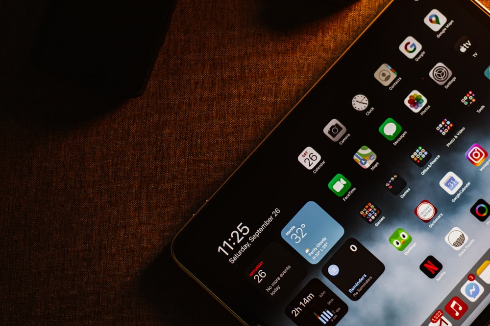 black remote control on brown wooden table