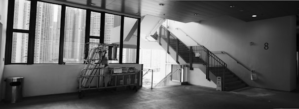 Before and after shots of a spotless stairwell in a residential building.