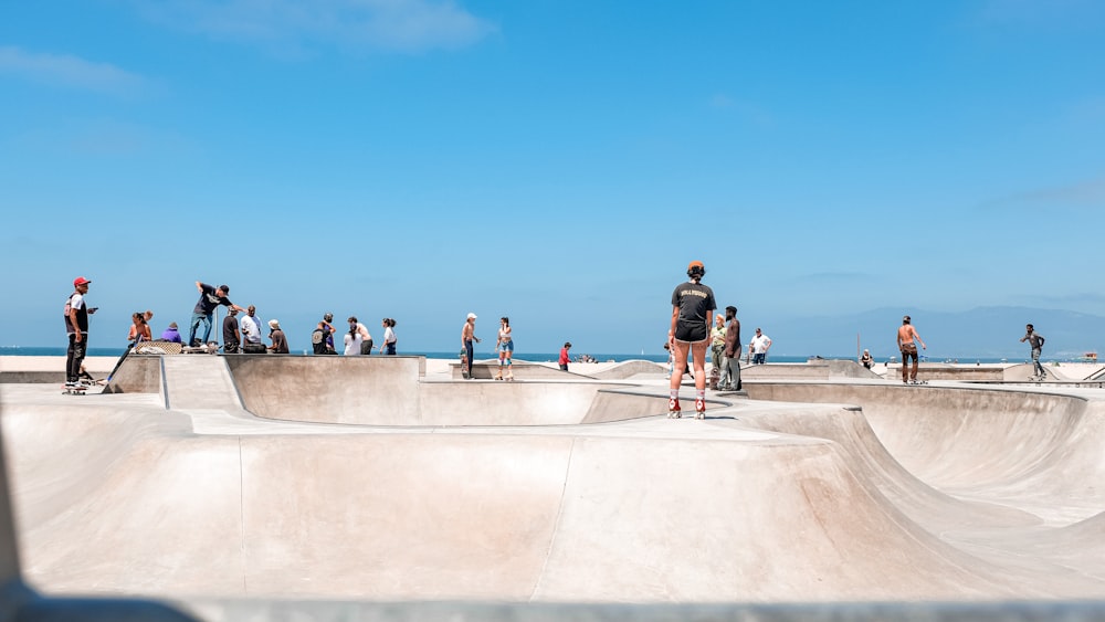 people walking on gray concrete pavement during daytime