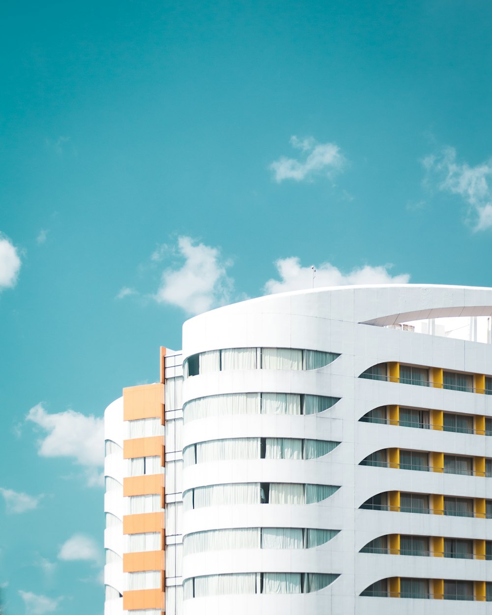 white and brown concrete building under blue sky during daytime