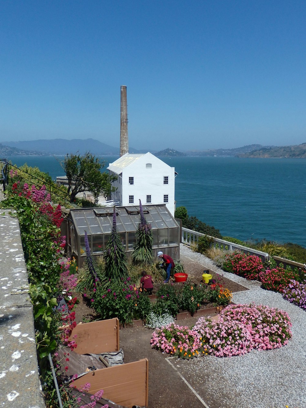 white concrete building near body of water during daytime