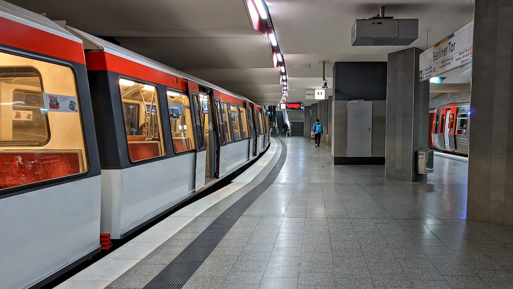 white and black train in train station