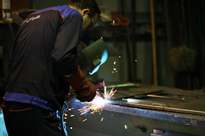 man in black jacket holding sparkler