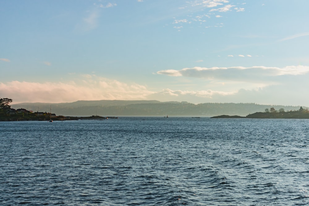 body of water under blue sky during daytime