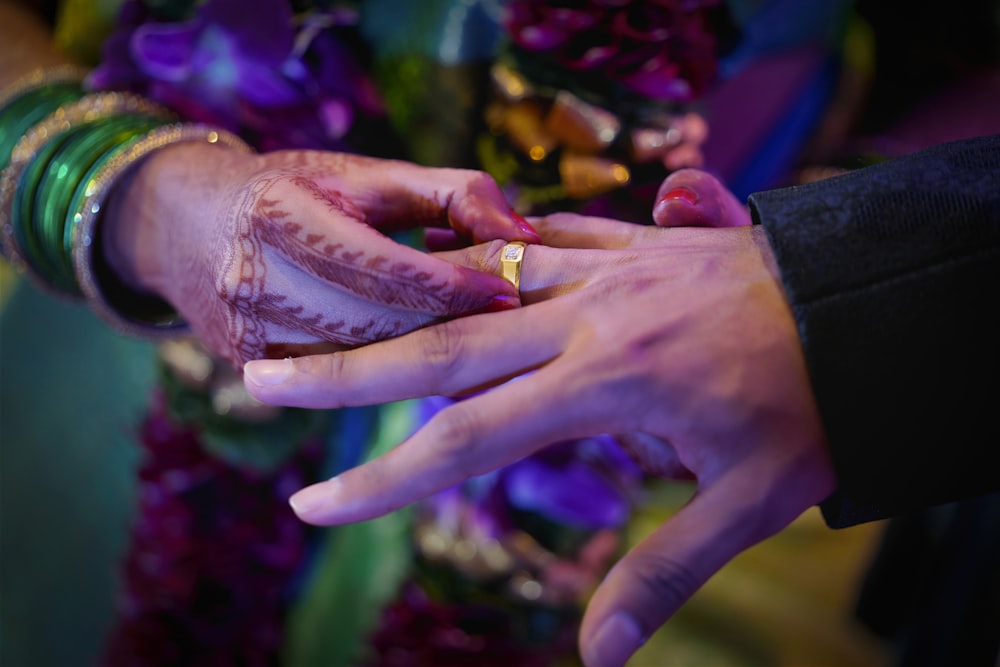 person with gold ring and gold ring