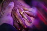 person wearing gold wedding band