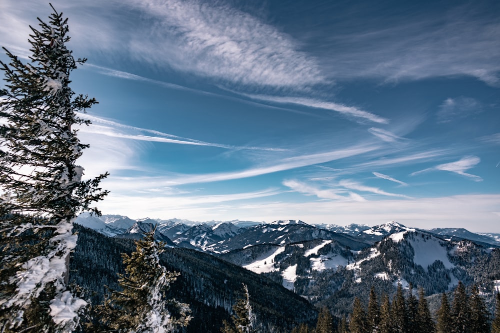 snow covered mountains under blue sky during daytime