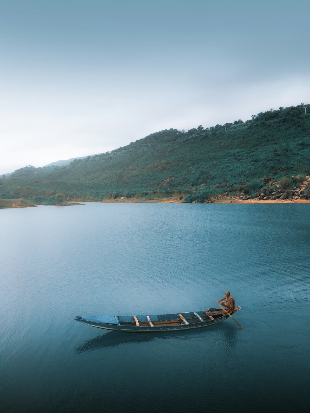 brown boat on body of water during daytime