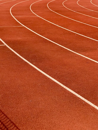a red running track with white lines on it