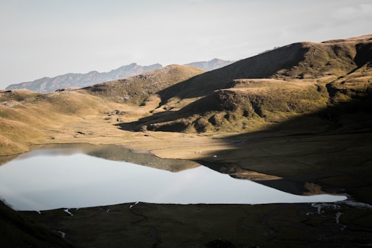 brown mountains near lake during daytime in Haute-Savoie France