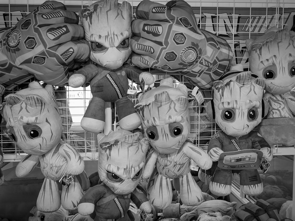 grayscale photo of animal plush toys